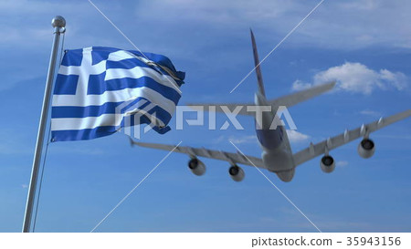 Commercial airplane landing behind waving Greek 35943156
