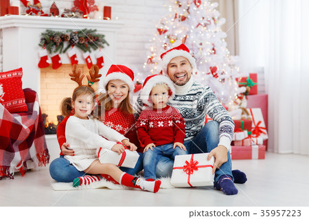 happy family mother father and children on Christmas morning happy family mother father and children on Christmas morning 35957223