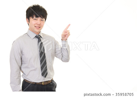 A smiling businessman to instruct A smiling businessman to instruct 35958705