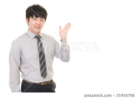 A smiling businessman to guide A smiling businessman to guide 35958706