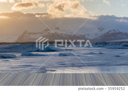 Ice freezing lake with volcano mountain Ice freezing lake with volcano mountain 35959252