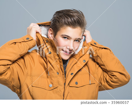 Teenage boy in winter clothes Teenage boy in winter clothes 35960037