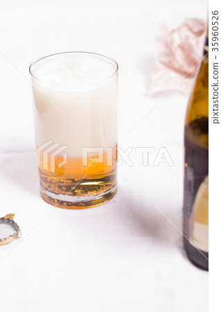 Glass with beer on the table 35960526