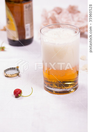 Glass with beer on the table 35960528