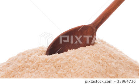 Heap of rice and a wooden spoon in it 35964736