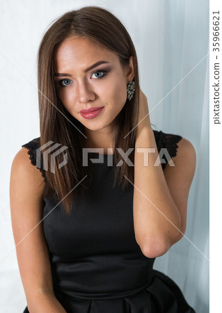 Beautiful young woman in black dress Beautiful young woman in black dress 35966621