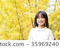 Autumn leaves and girl 35969240
