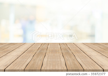 Empty wood table top on white blurred background Empty wood table top on white blurred background 35972377