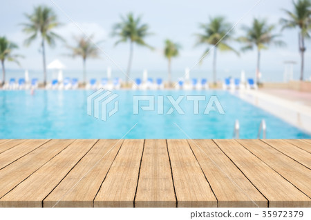 Empty wooden table in on blurred background Empty wooden table in on blurred background 35972379
