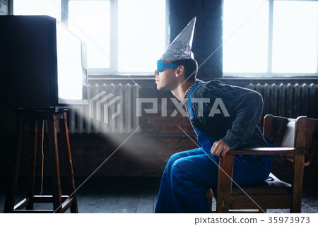 Man in tinfoil helmet and glasses, UFO phobia 35973973