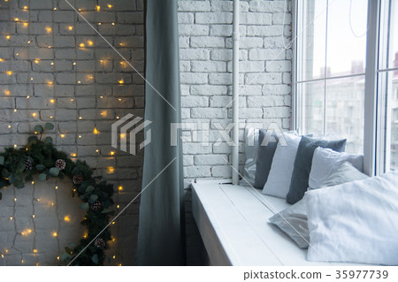 Design of the brick wall with a spruce wreath Design of the brick wall with a spruce wreath 35977739