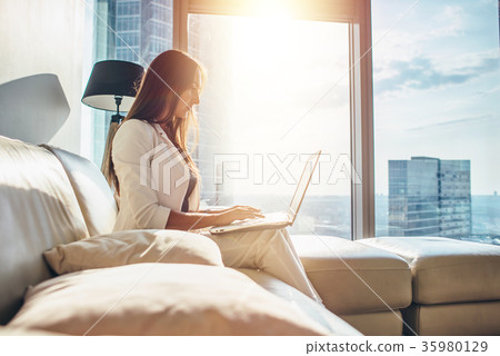 Side view of successful young female entrepreneur Side view of successful young female entrepreneur 35980129