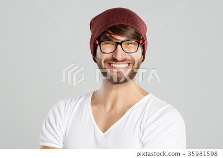 Handsome young man posing at studio Handsome young man posing at studio 35981598