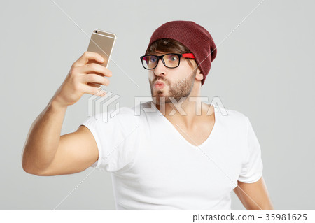 Handsome young man posing at studio 35981625