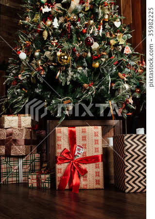 decorated Christmas tree and presents in a box decorated Christmas tree and presents in a box 35982225