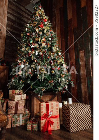 decorated Christmas tree and presents in a box decorated Christmas tree and presents in a box 35982227