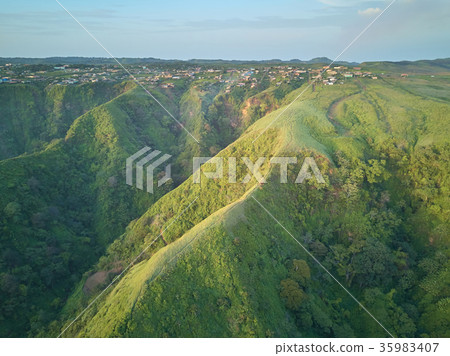 Small town on green hills Small town on green hills 35983407