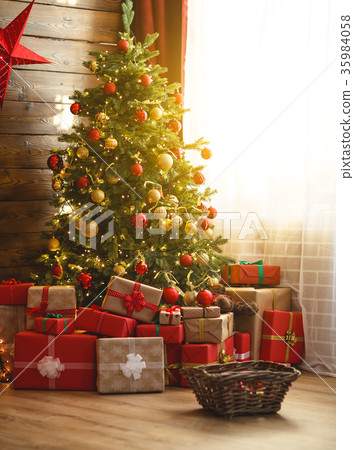 interior christmas. magic glowing tree, fireplace, gifts 35984058