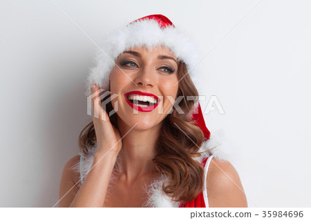 Girl wearing santa claus clothes 35984696