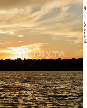 Postcard with an amazing sunset on a lake 35985826