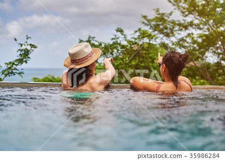Back view on two girl in pool 35986284
