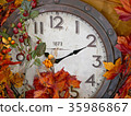 Vintage clock with autumn leaf decoration. 35986867