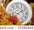 Vintage clock in autumn decorative leaves. 35986868