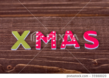 Word Xmas from wooden letters. Word Xmas from wooden letters. 35988020