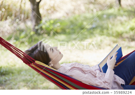 Young woman, park, reading 35989224