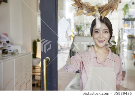 Young woman, florist, cleaning Young woman, florist, cleaning 35989486