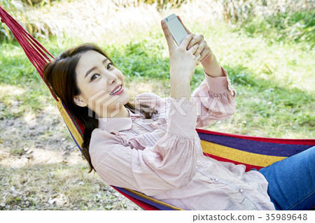 Young woman, park, smart phone Young woman, park, smart phone 35989648