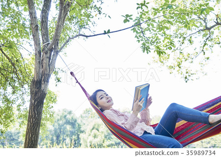 Young woman, park, reading Young woman, park, reading 35989734