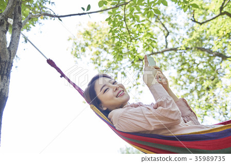 Young woman, park, smart phone Young woman, park, smart phone 35989735
