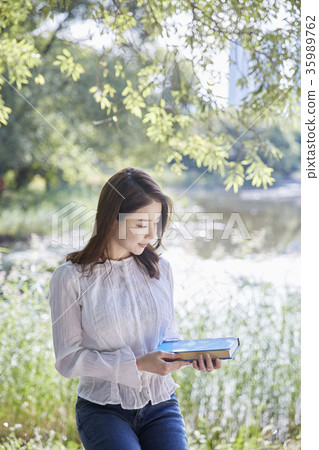 Young woman, park, reading 35989762