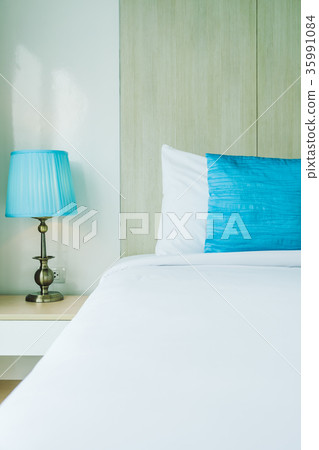 Comfortable pillow on bed 35991084