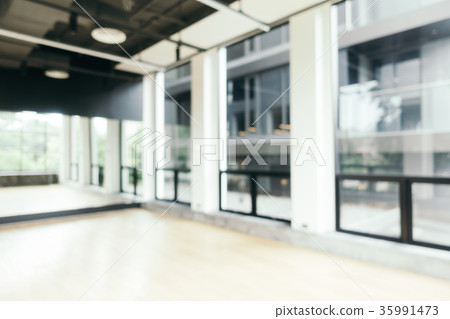 Abstract blur fitness equipment in gym room interior 35991473