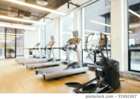 Abstract blur fitness equipment in gym room interior 35992807
