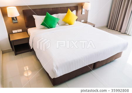Comfort pillow on bed decoration interior 35992808