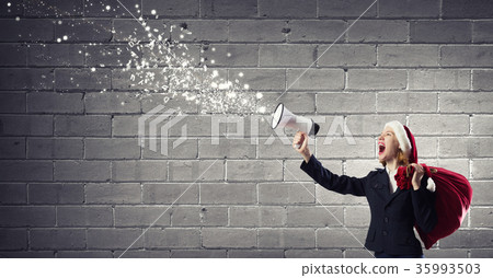 Female Santa with megaphone 35993503
