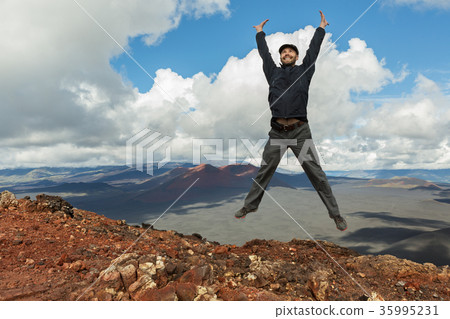 Tourist at the top of Hiking trail climb to North Tourist at the top of Hiking trail climb to North 35995231