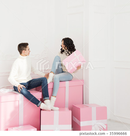 Loving couple of teens and gifts 35996666