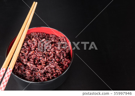 brown rice in the black bowl brown rice in the black bowl 35997946