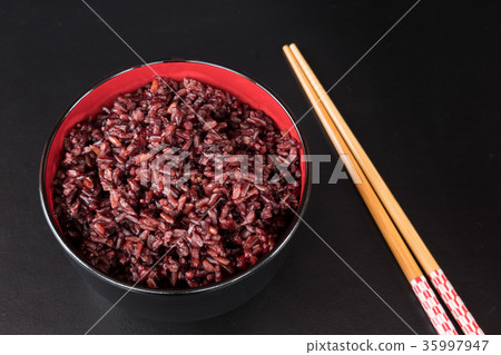 brown rice in the black bowl brown rice in the black bowl 35997947