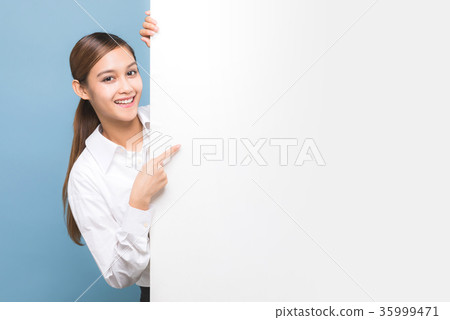 A woman at a message board A woman at a message board 35999471