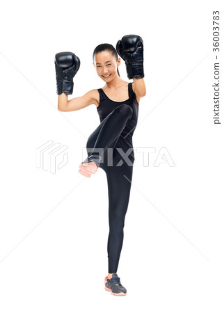Portrait of young Asian woman fighter in boxing gloves training 36003783