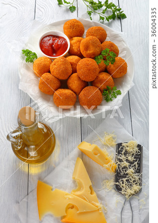 potato croquettes with ketchup, top view potato croquettes with ketchup, top view 36004335