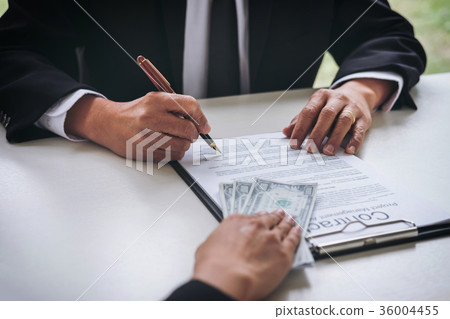 Bribery and corruption concept, bribe in the form of dollar bill Bribery and corruption concept, bribe in the form of dollar bill 36004455