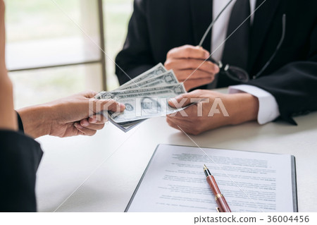 Bribery and corruption concept, bribe in the form of dollar bill 36004456