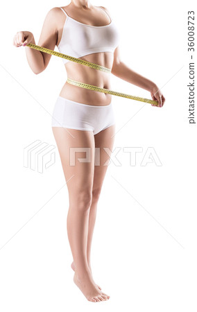 Overweight woman measuring her fat belly. 36008723