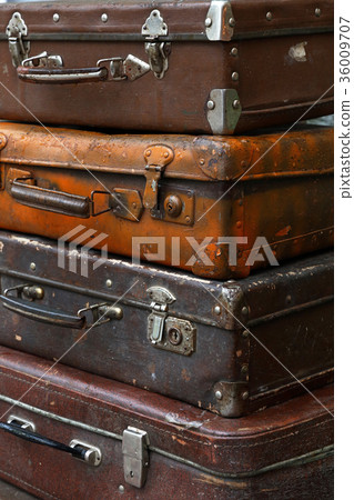 Stack of old vintage travel suitcases close up Stack of old vintage travel suitcases close up 36009707